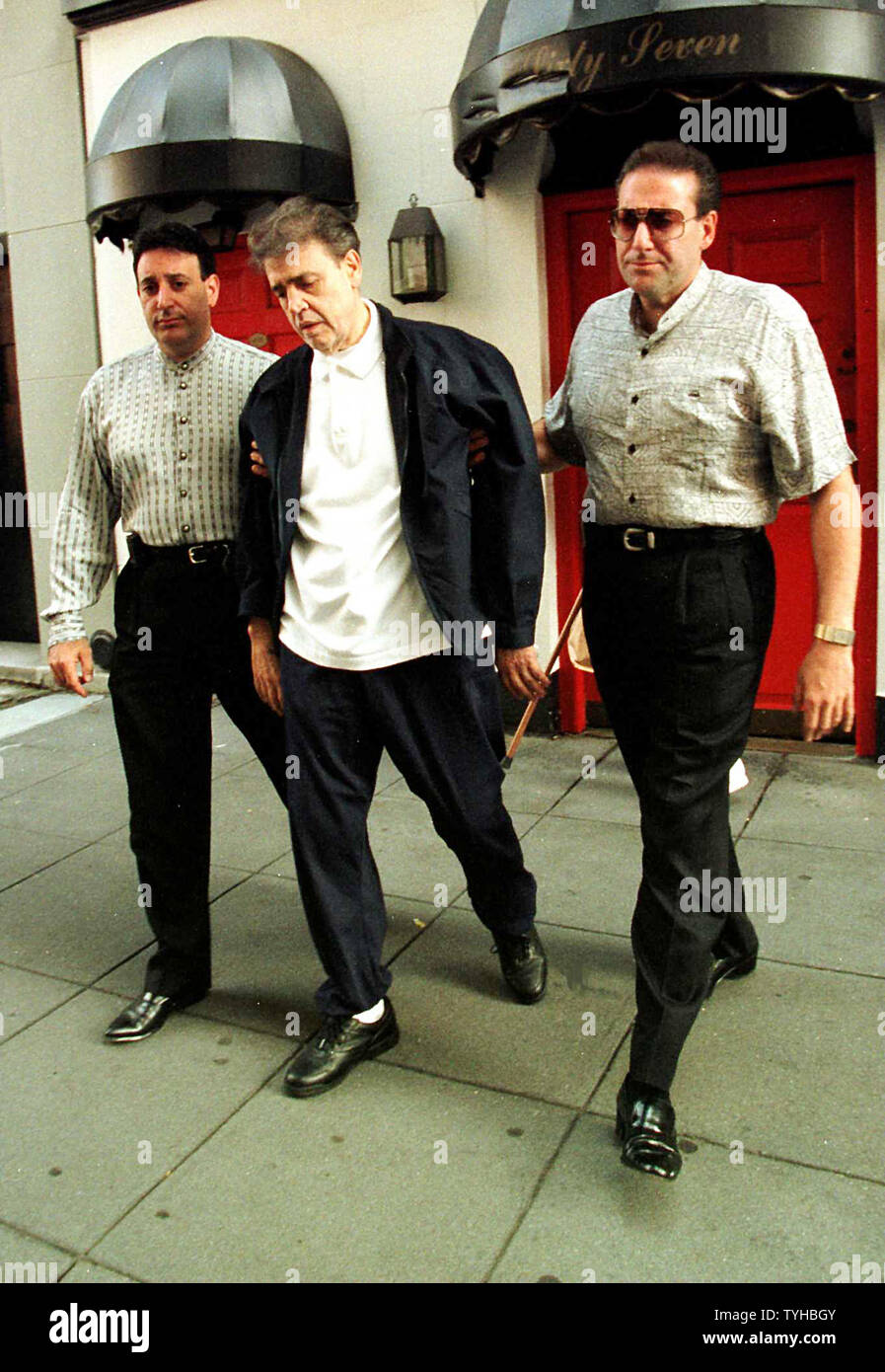 Mob boss Vincent "The Chin" Gigante shown in July 1997 escorted by aides in New York City