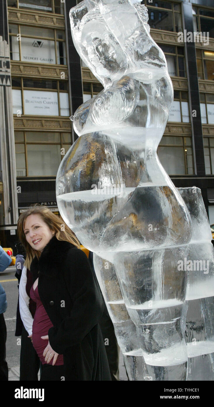 Martha Byrne, who plays in 'As the World Turns' and  is expecting, poses besides an ice sculpture of a pregnant woman outside of the Destination Maternity store which is celebrating its grand opening on February 1, 2006 in New York City. The flagship store offers maternity clothing, exercise classes and even a lounge for the fathers-to-be. (UPI Photo/Monika Graff) Stock Photo