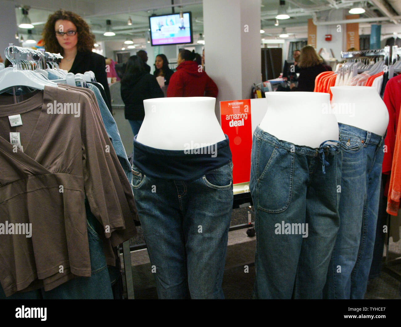 Mannequins with pregnant bellies display jeans at Destination Maternity, the flagship store which offers maternity clothing, exercise classes and even a lounge for the fathers-to-be, celebrates its grand opening on February 1, 2006 in New York City. (UPI Photo/Monika Graff) Stock Photo