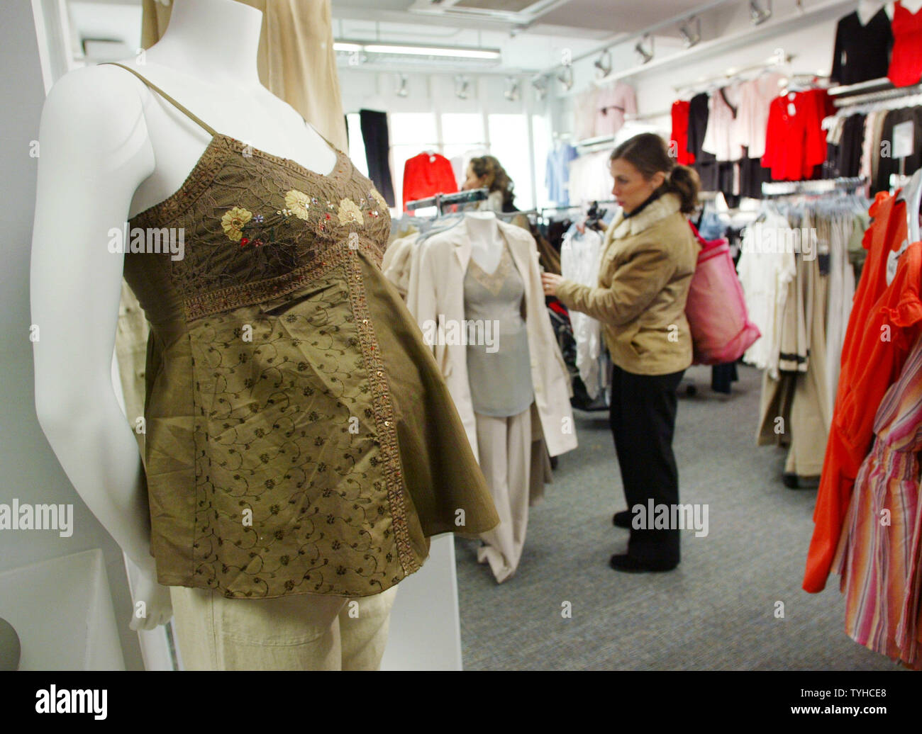 Shoppers brows through Destination Maternity, the flagship store which offers maternity clothing, exercise classes and even a lounge for the fathers-to-be, celebrates its grand opening on February 1, 2006 in New York City. (UPI Photo/Monika Graff) Stock Photo