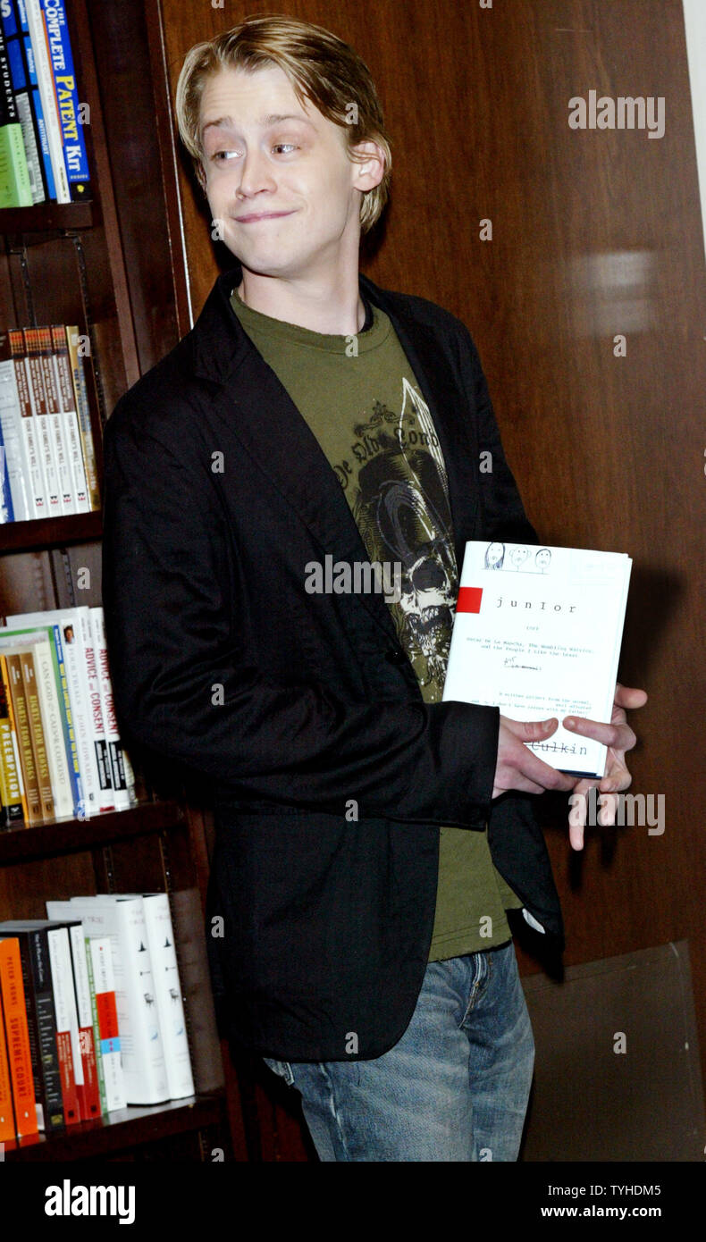 Actor Macaulay Culkin poses with his new book 'Junior' during a book signing on March 13, 2006 in New York City. Culkin, who was the highest-paid child star ever, wrote a story based on his dysfunctional family upbringing. (UPI Photo/Monika Graff) Stock Photo