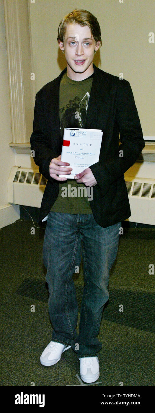 Actor Macaulay Culkin poses with his new book 'Junior' during a book signing on March 13, 2006 in New York City. Culkin, who was the highest-paid child star ever, wrote a story based on his dysfunctional family upbringing. (UPI Photo/Monika Graff) Stock Photo
