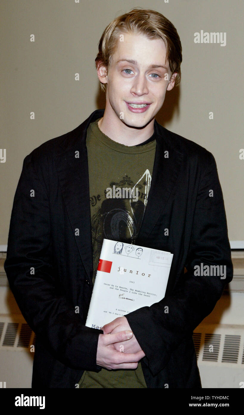 Actor Macaulay Culkin poses with his new book 'Junior' during a book signing on March 13, 2006 in New York City. Culkin, who was the highest-paid child star ever, wrote a story based on his dysfunctional family upbringing. (UPI Photo/Monika Graff) Stock Photo