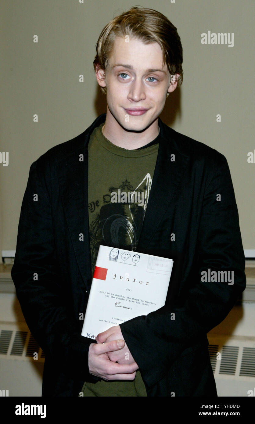 Actor Macaulay Culkin poses with his new book 'Junior' during a book signing on March 13, 2006 in New York City. Culkin, who was the highest-paid child star ever, wrote a story based on his dysfunctional family upbringing. (UPI Photo/Monika Graff) Stock Photo