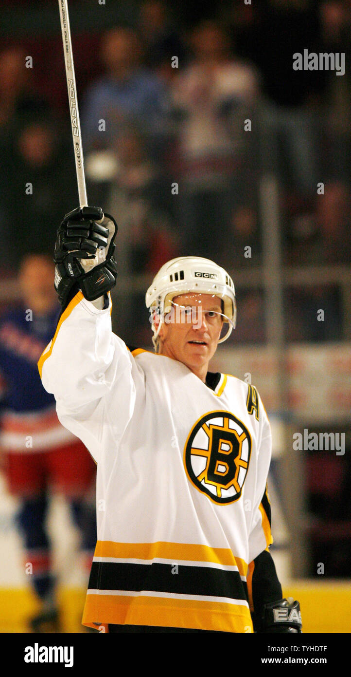 Boston Bruins (22) Brian Leetch raises his stick up to the fans before the  first period at Madison Square Garden in New York City on March 20, 2006.  (UPI Photo/John Angelillo Stock