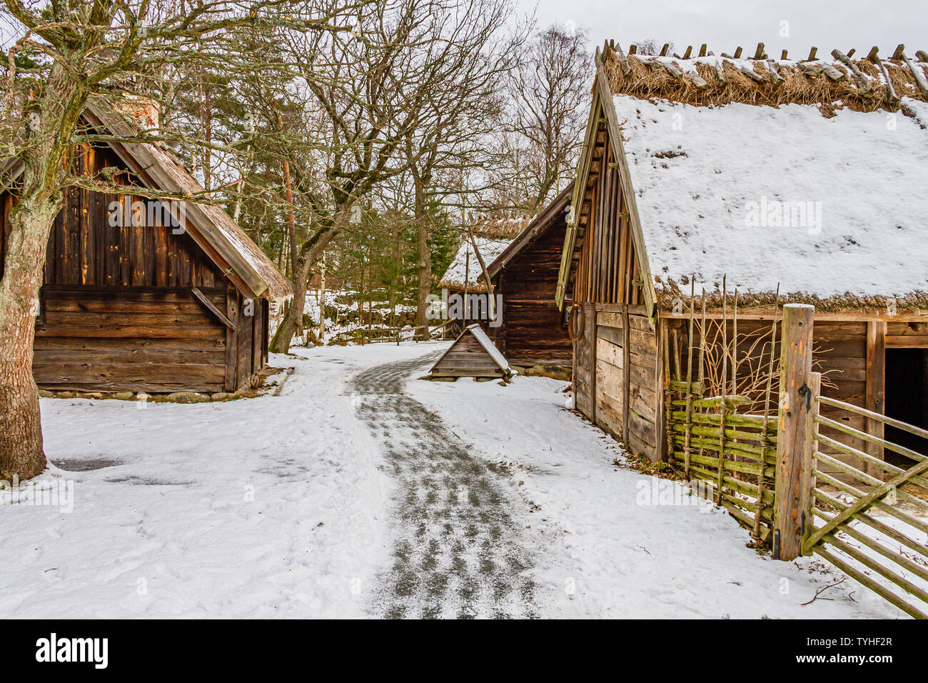 Traditional Swedish farm buildings in Skansen open-air museum, Stockholm, Sweden. January 2019. Stock Photo