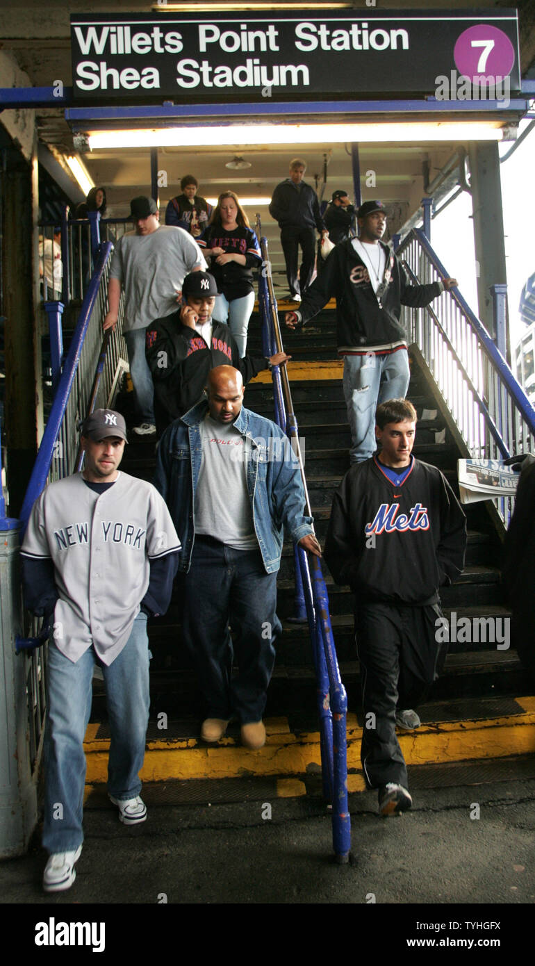 New York Yankees and Mets fans exit the Number 7 train station at