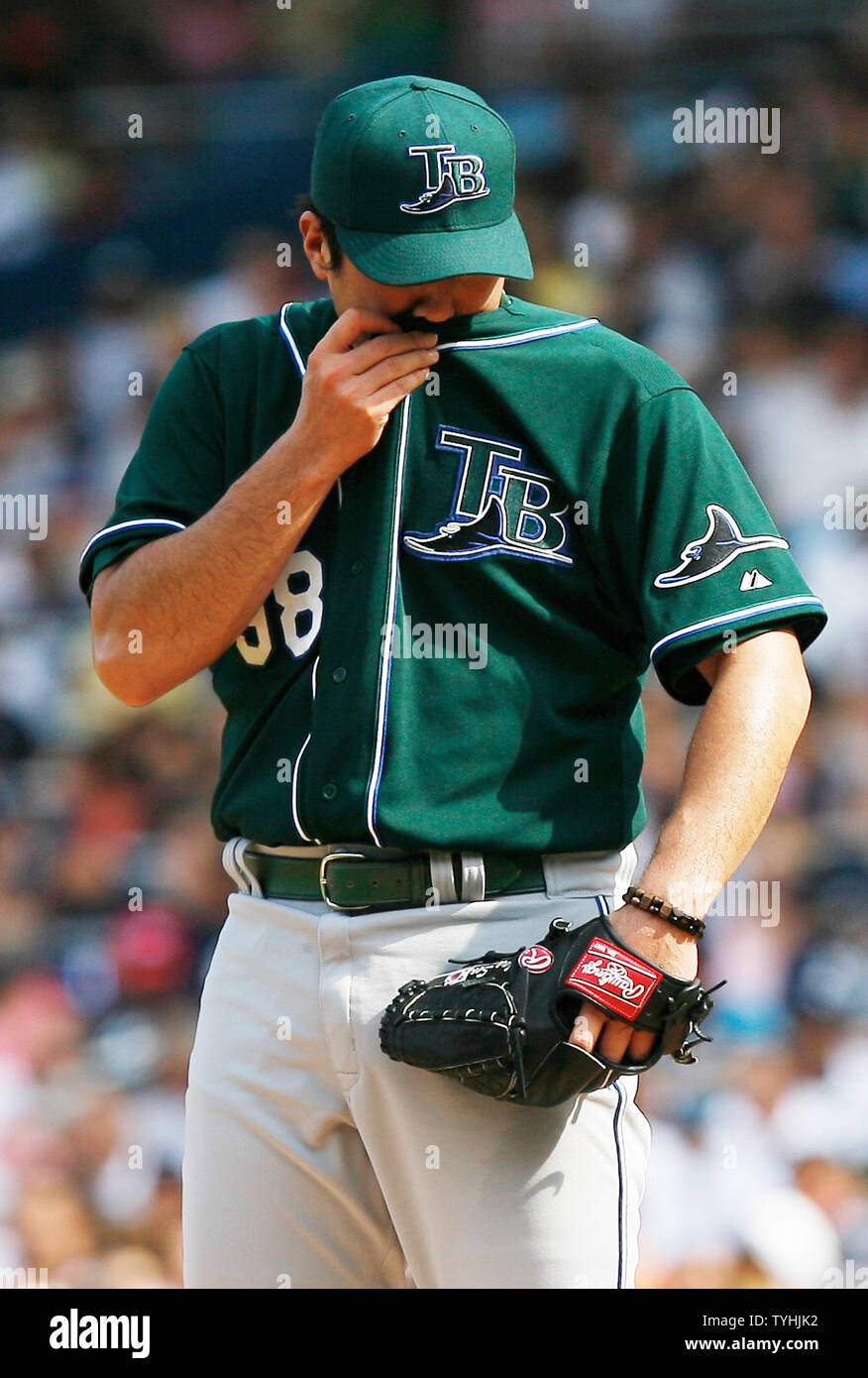 Tampa Bay Devil Rays Jae Seo wipes his face on his shirt in the first  inning at Yankees Stadium in New York City on July 29, 2006. The Tampa Bay  Devil Rays