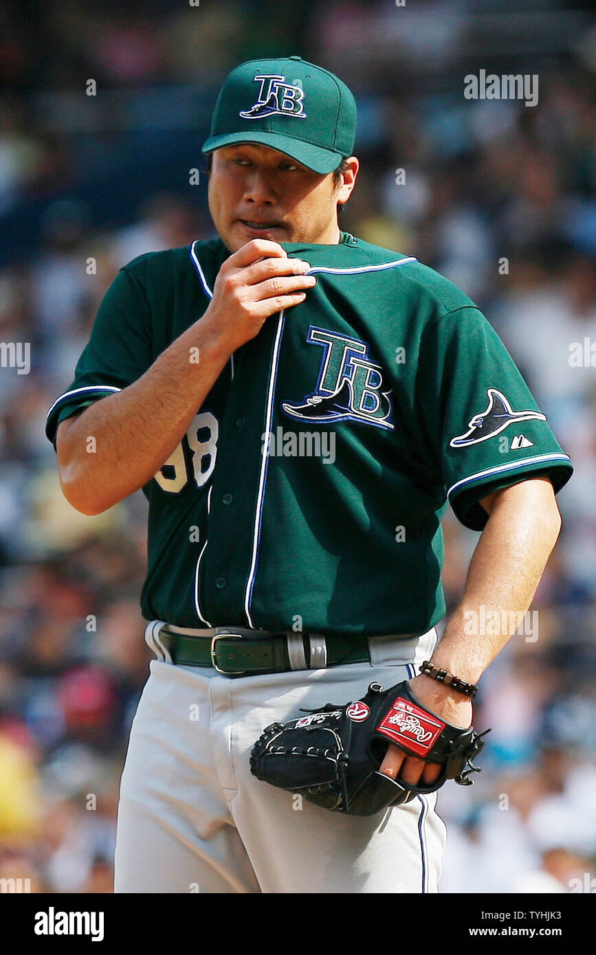 Tampa Bay Devil Rays Jae Seo wipes his face on his shirt in the first  inning at Yankees Stadium in New York City on July 29, 2006. The Tampa Bay Devil  Rays