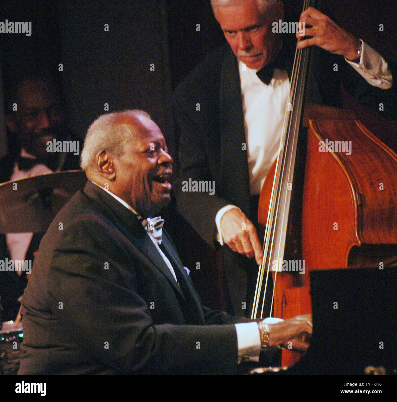 Legendary Jazz pianist Oscar Peterson performs in New York at the Birdland Jazz club with David Young (bass) on August 22, 2006. (UPI Photo/Ezio Petersen) Stock Photo