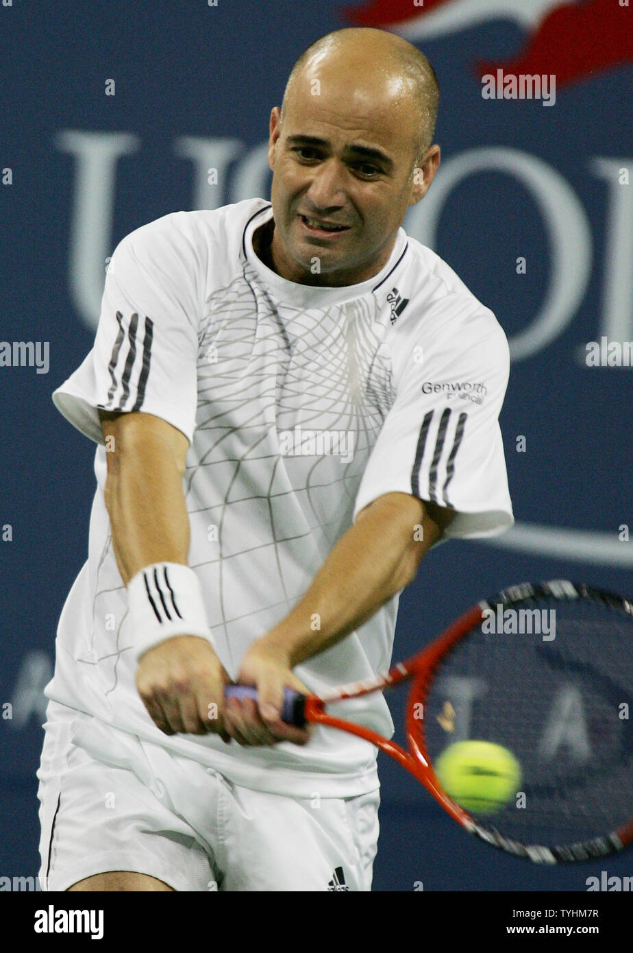 Andre Agassi (USA) takes on eighth-seeded player Marcos Baghdatis of Cyprus  during their first set at the US Open held at the USTA Billie Jean King  National Tennis Center on August 31,