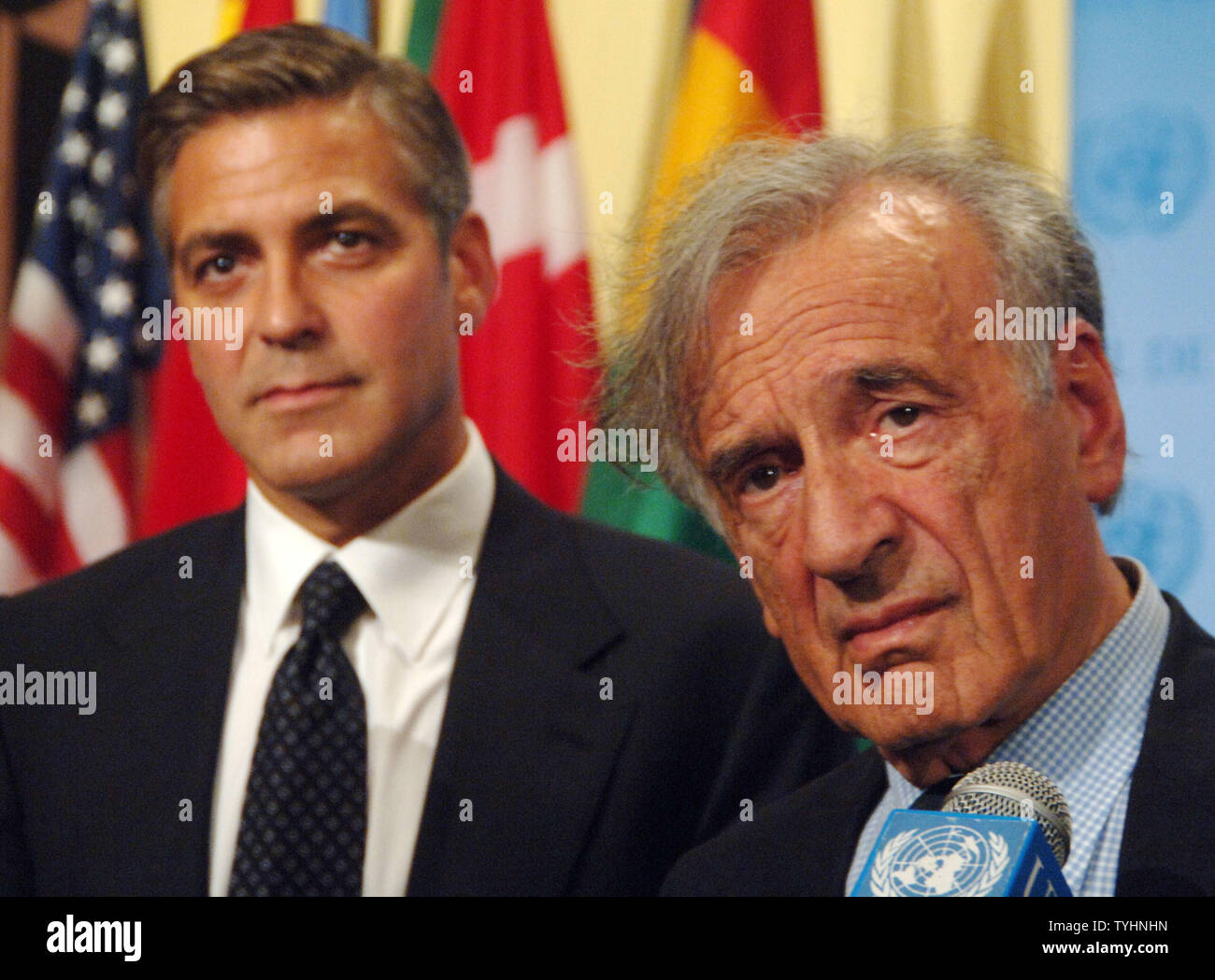 Actor/producer George Clooney and Nobel Peace Prize winner Dr. Elie Wiesel (right) meet the UN media after a 'Arria' style meeting of the United Nations Security Council members on the subject of Dafur, Sudan on September 14, 2006 in New York. The meeting was called for by the U.S. Mission to the UN and the Elie Wiesel Foundation.   (UPI Photo/Ezio Petersen) Stock Photo