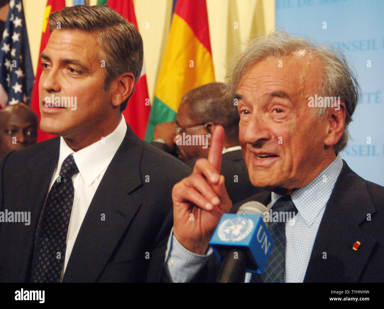 Actor/producer George Clooney and Nobel Peace Prize winner Dr. Elie Wiesel (right) meet the UN media after a 'Arria' style meeting of the United Nations Security Council members on the subject of Dafur, Sudan on September 14, 2006 in New York. The meeting was called for by the U.S. Mission to the UN and the Elie Wiesel Foundation.   (UPI Photo/Ezio Petersen) Stock Photo