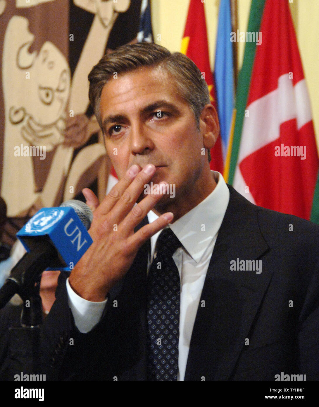 Actor/producer George Clooney ponders a question from the UN media after attending a 'Arria' style meeting of the United Nations Security Council members on the subject of Dafur, Sudan on September 14, 2006 in New York. The meeting was called for by the U.S. Mission to the UN and the Elie Wiesel Foundation.   (UPI Photo/Ezio Petersen) Stock Photo