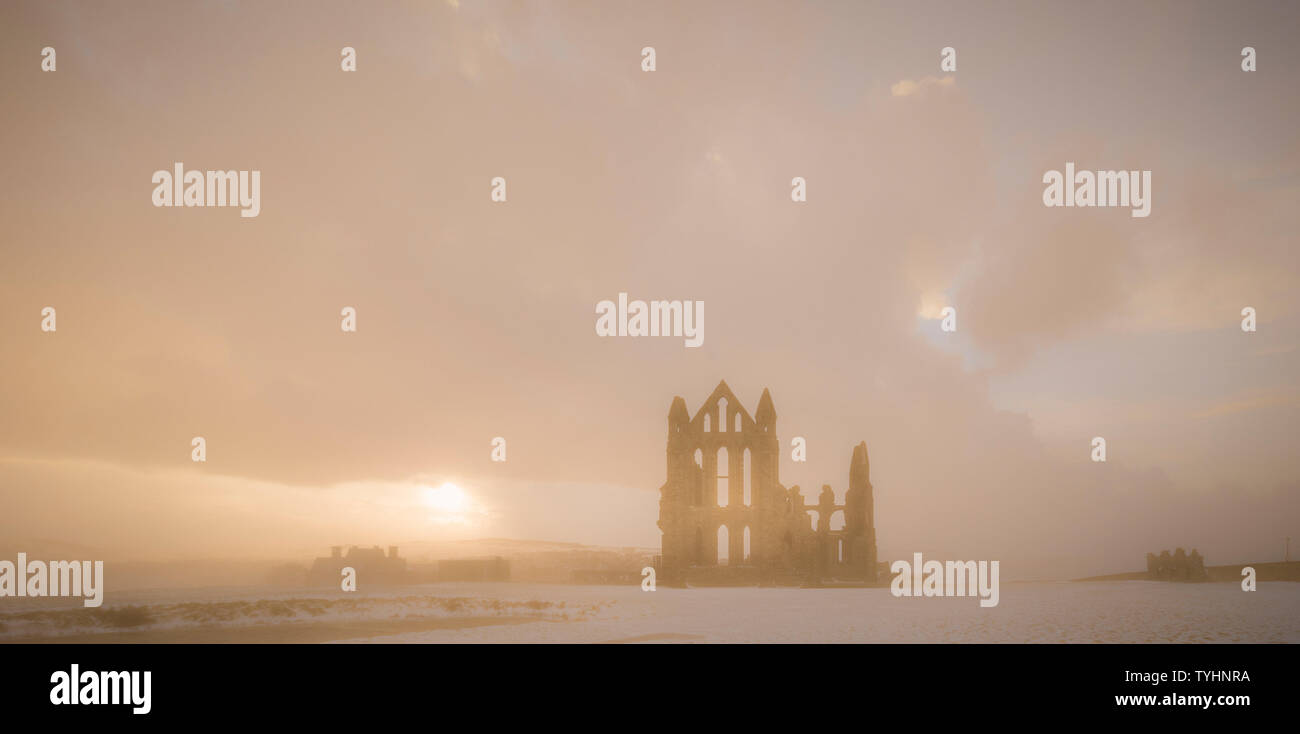Whitby Abbey in snow, North Yorkshire, UK Stock Photo