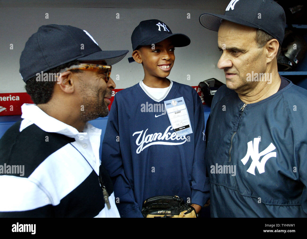 Film maker Spike Lee, left, and his son Jackson, 9, chat with New York  Yankees's manager Joe Torre before the start off the Yankees' game against  the Boston Red Sox at Yankee