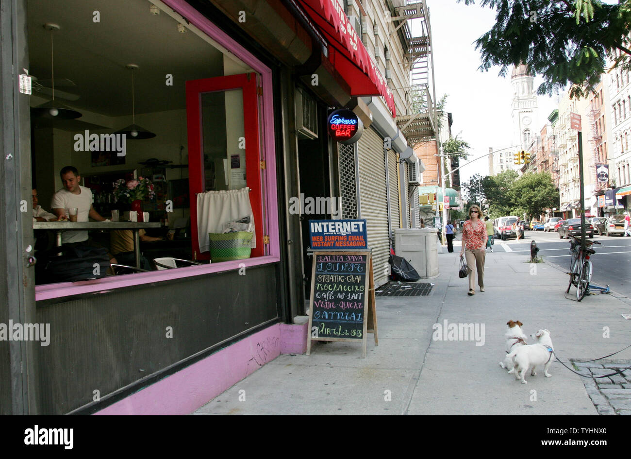 People walk along the sidewalks in the Lower East Side, also known