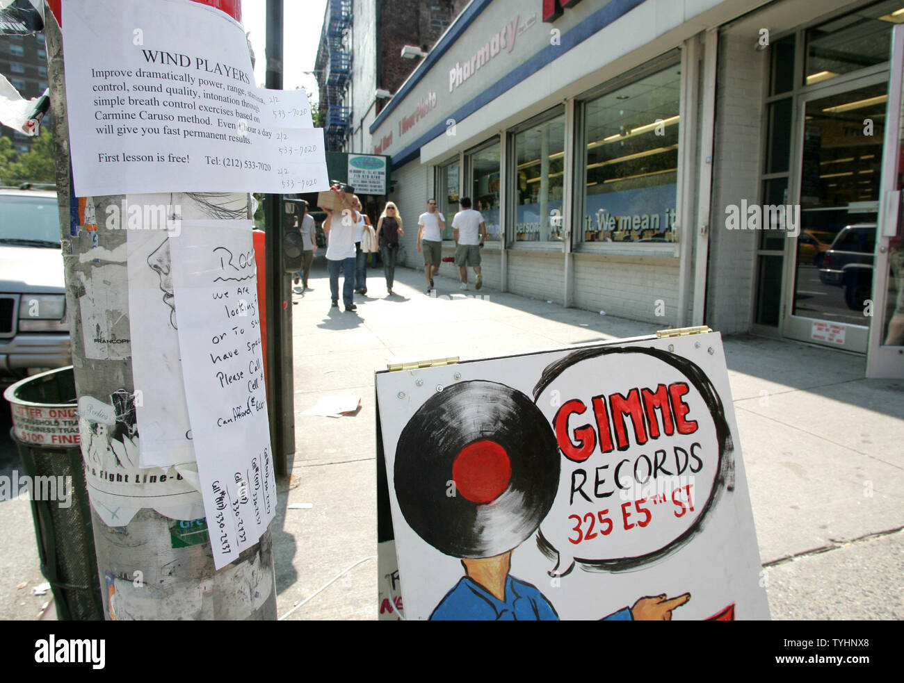 People walk along the sidewalks in the Lower East Side, also known