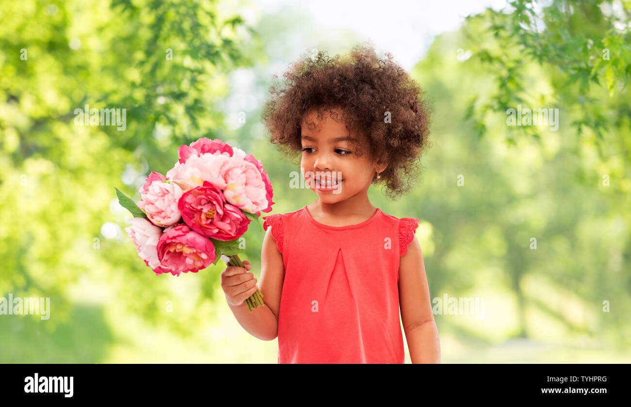happy little african american girl with flowers Stock Photo - Alamy
