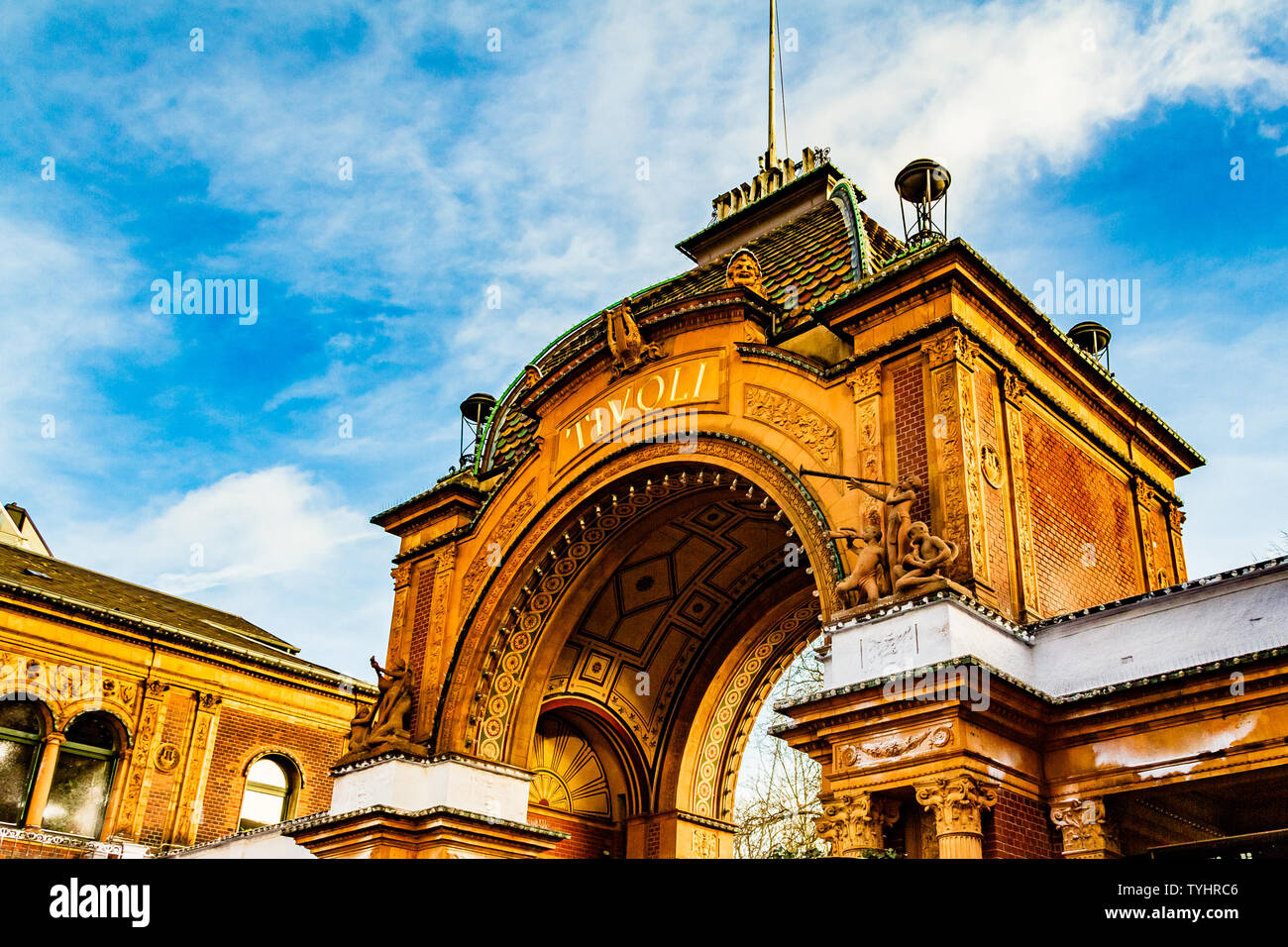 Decorative gated entrance to the 19th century Tivoli Gardens amusement park on Vesterbrogade, Copenhagen, Denmark. January 2019. Stock Photo