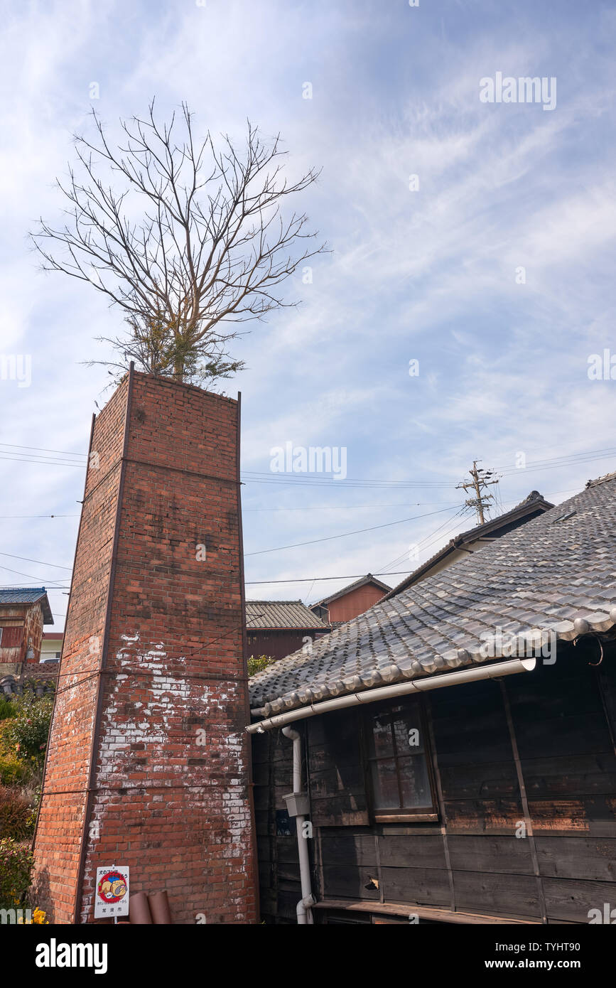 Tree growing out of the chimney at the Tokoname pottery footpath, located close to Nagoya Chubu Centrair International Airport. Stock Photo