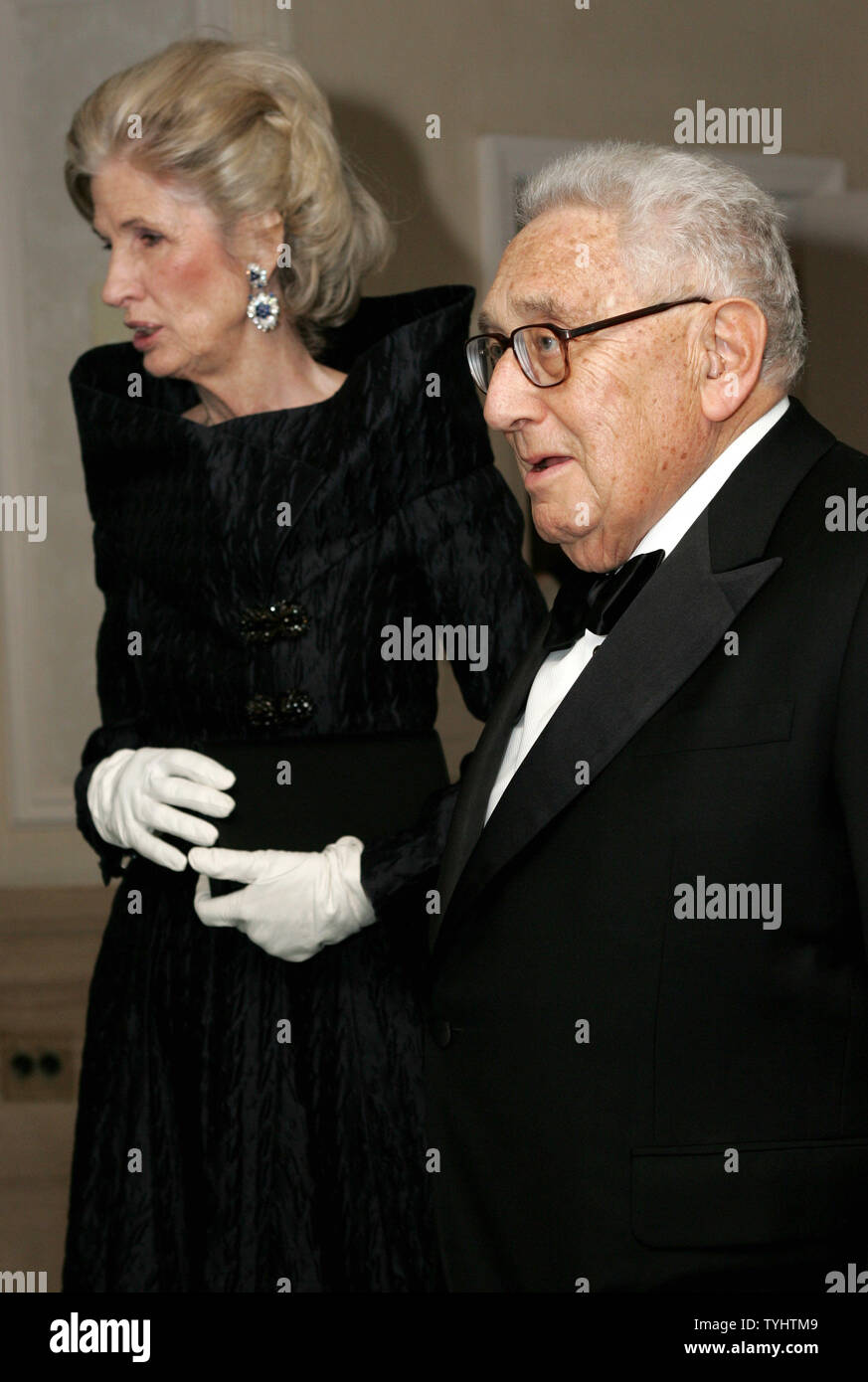 Former Secretary of State Henry Kissinger is accompanied by his wife Nancy as they arrive to the Leo Baeck Institute award dinner on November 29, 2006 in New York City. The institute is dedicated to the study of German-Jewish history by offering research archives and operating a library and a museum. (UPI Photo/Monika Graff) Stock Photo