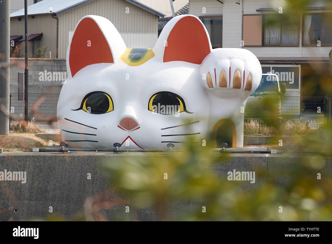 Maneki-neko head at the Tokoname pottery footpath, located close to Nagoya Chubu Centrair International Airport. Stock Photo