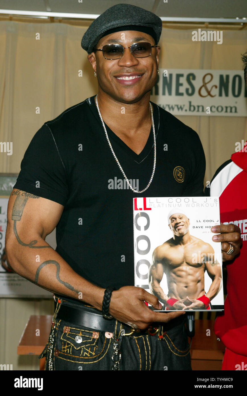 LL Cool J poses for pictures before signing copies of his new book 