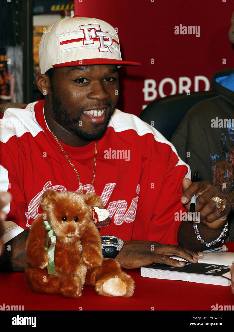 50 Cent signs copies of 