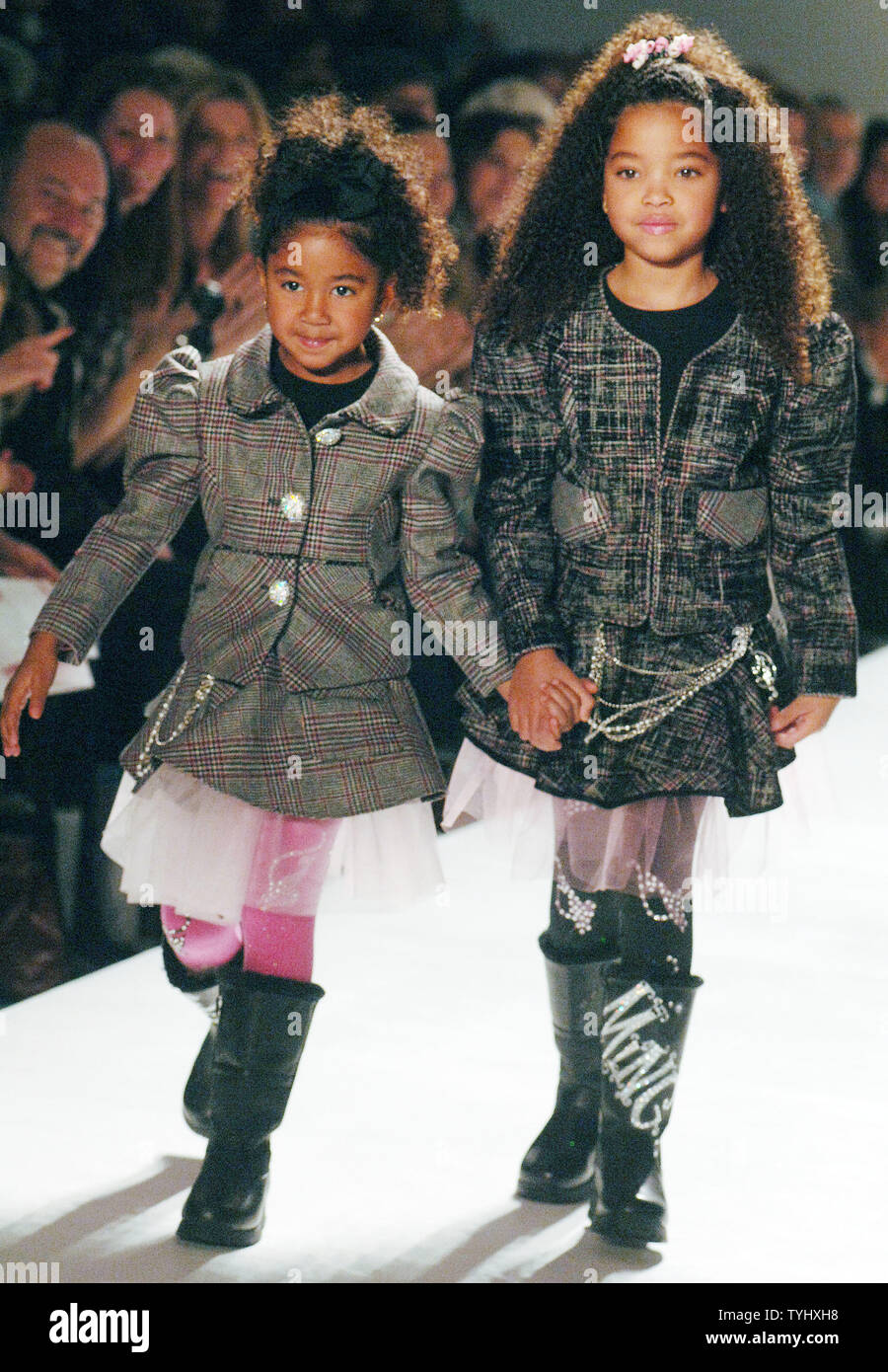 The children of Kimoria and Russell Simmons, Ming Lee Simmons and Aoki Lee Simmons walk the runway in the Child Magazine's Fall 2007 Fashion show in New York on February 9, 2007.    (UPI Photo/Ezio Petersen) Stock Photo