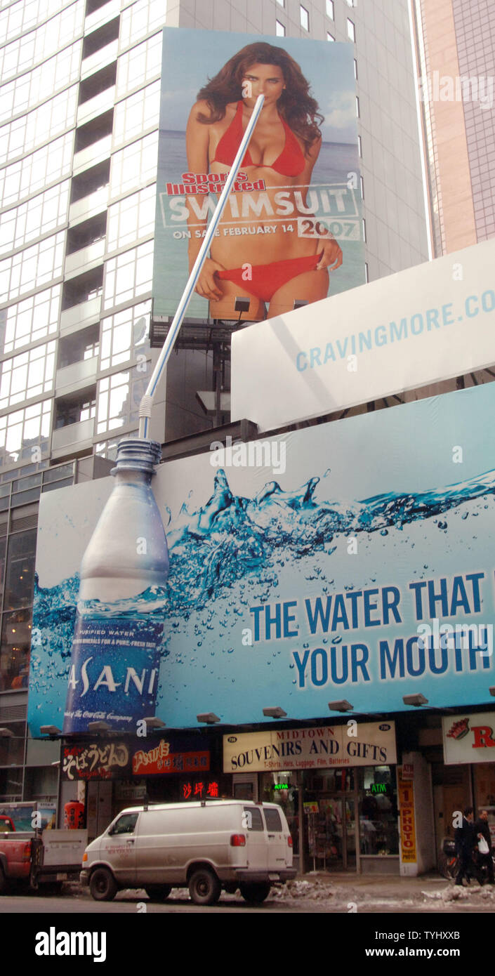 A new ad gimmick industry insiders call 'Co-bill boarding' was unveiled over New York's Time Square district when billboards promoting Dasani water and Sports Illustrated magazine swim suit issue were unveiled. Dasani paid for both billboards and got to pick the billboard model as seen in this February 20, 2007 photo.  (UPI Photo/Ezio Petersen) Stock Photo