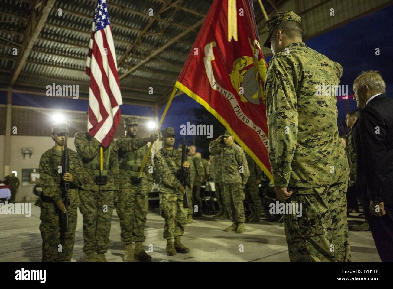 U.S. Marines with Special Purpose Marine Purpose Marine Air-Ground Task Force - Southern Command present the colors during the playing of the Star Spangled Banner during the celebration of the 241st Marine Corps Birthday Ball aboard Soto Cano Air Base, Honduras, Nov. 10, 2016. The celebration honors those past, present, and future Marines throughout history and marks the 241st Marine Corps Birthday since its founding on Nov. 10, 1775. Stock Photo