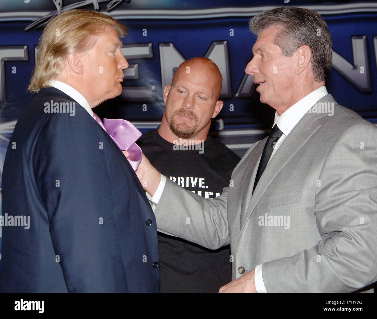 Wrestler/referee Stone Cold Steve Austin (C) looks on while World Wrestling Entertainment CEO Vince McMahon (R) pulls on the tie of business icon Donald Trump during a March 28, 2007 photo op in New York to announce their upcoming 'Battle of the Billionaires' match on April 1, 2007 in Detroit. (UPI Photo/Ezio Petersen) Stock Photo