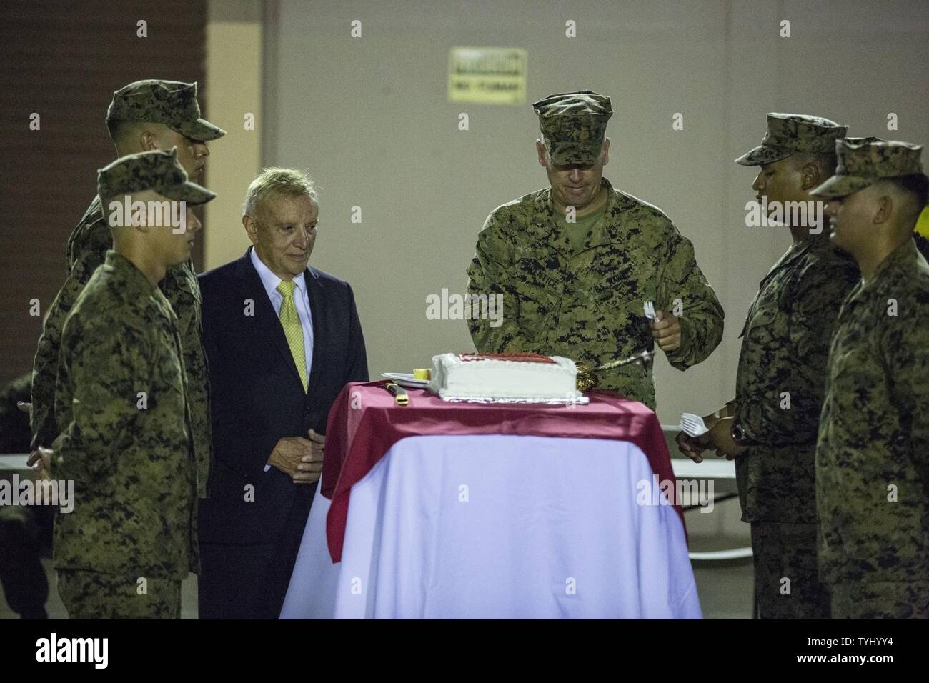 U.S. Marine veteran Patrick Timothy Brent, left, guest of honor, and Col. Thomas Prentice, commanding officer for Special Purpose Marine Air-Ground Task Force - Southern Command, cut the ceremonial cake during the celebration of the 241st Marine Corps Birthday Ball aboard Soto Cano Air Base, Honduras, Nov. 10, 2016. The celebration honors those past, present, and future Marines throughout history and marks the 241st Marine Corps Birthday since its founding on Nov. 10, 1775. Stock Photo