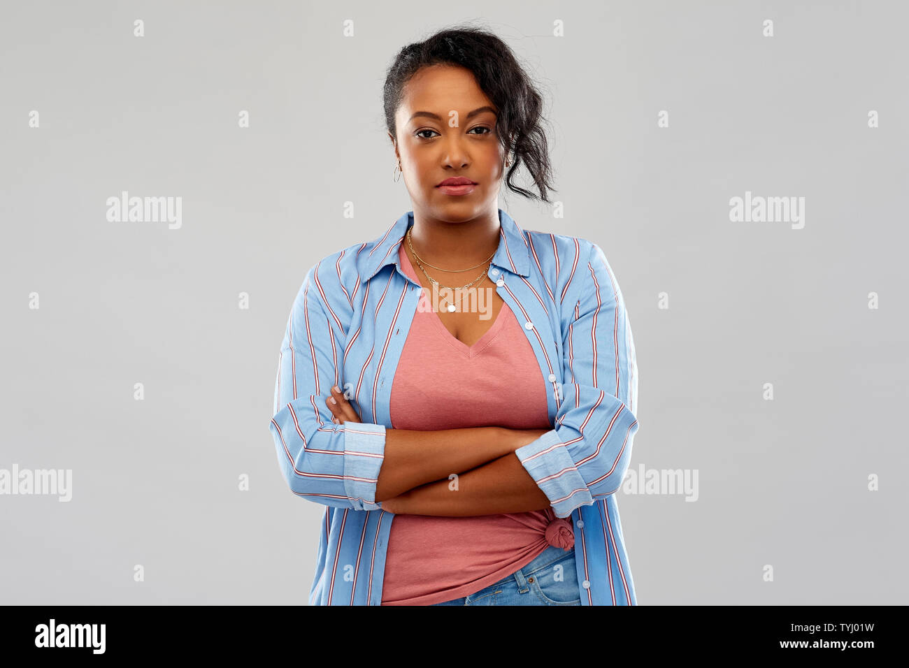 confident african american woman with crossed arms Stock Photo - Alamy
