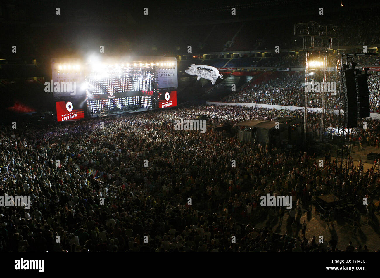 Fans stand up at during the Roger Waters performance at Live Earth, the concerts for a climate in crisis, at Giants Stadium in East Rutherford, New Jersey on July 7, 2007.  (UPI Photo/John Angelillo) Stock Photo