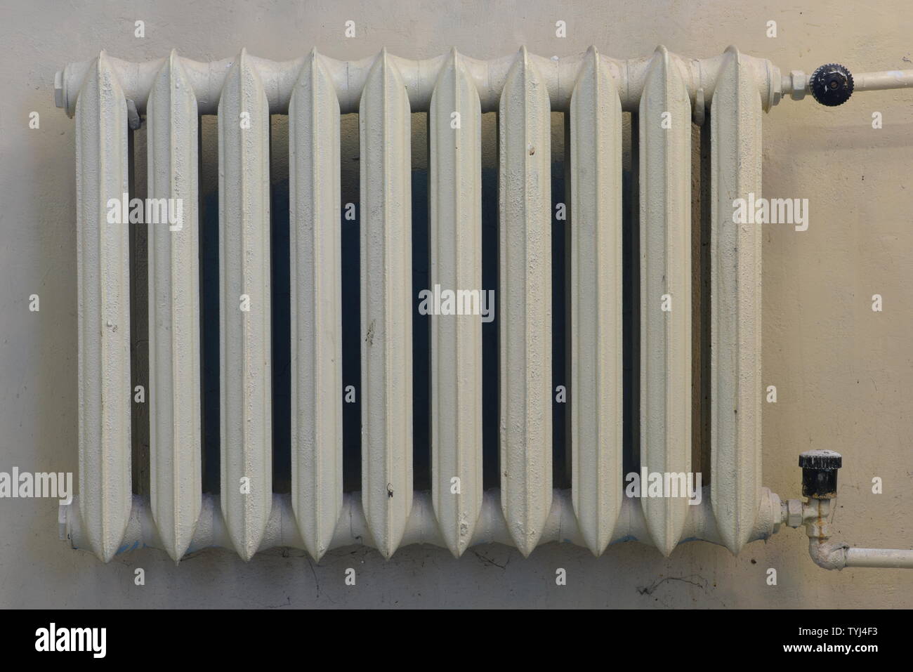 Cast iron radiator on the wall Stock Photo