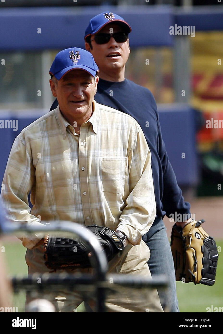 (L-R) Robin Williams and John Travolta play the infield while shooting the movie 'Old Dogs' at Shea Stadium in New York City on July 26, 2007.  (UPI Photo/John Angelillo) Stock Photo