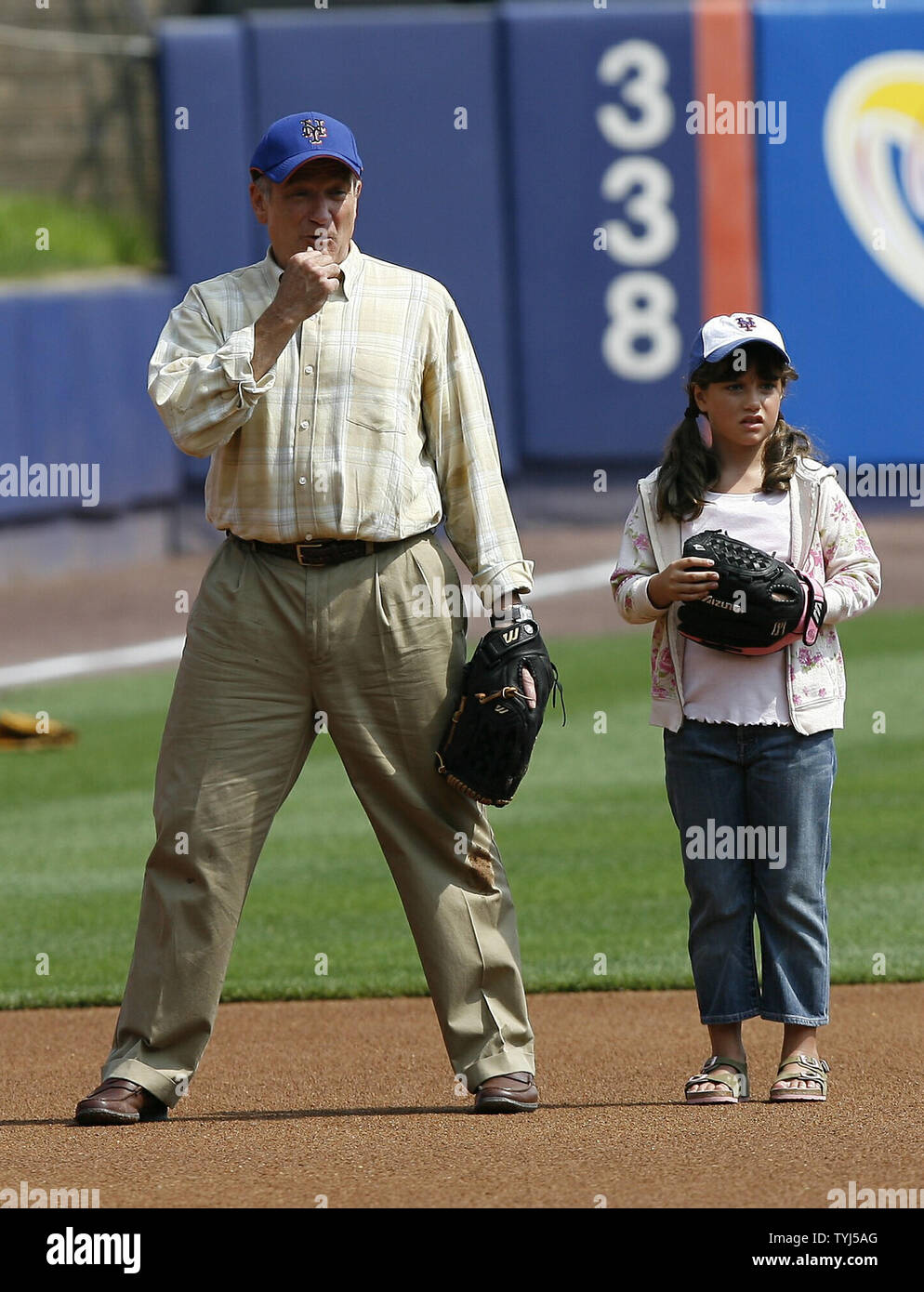 (L-R) Robin Williams and Ella Travolta stand in the infield on the set of the movie 'Old Dogs' at Shea Stadium in New York City on July 26, 2007.  (UPI Photo/John Angelillo) Stock Photo