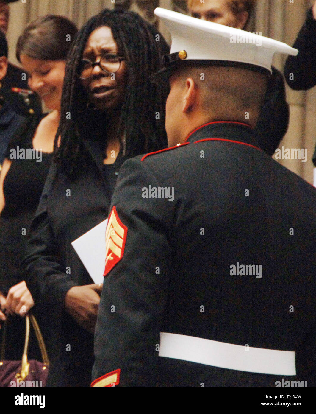Actress Whoopie Goldberg (C) leaves funeral services for socialite