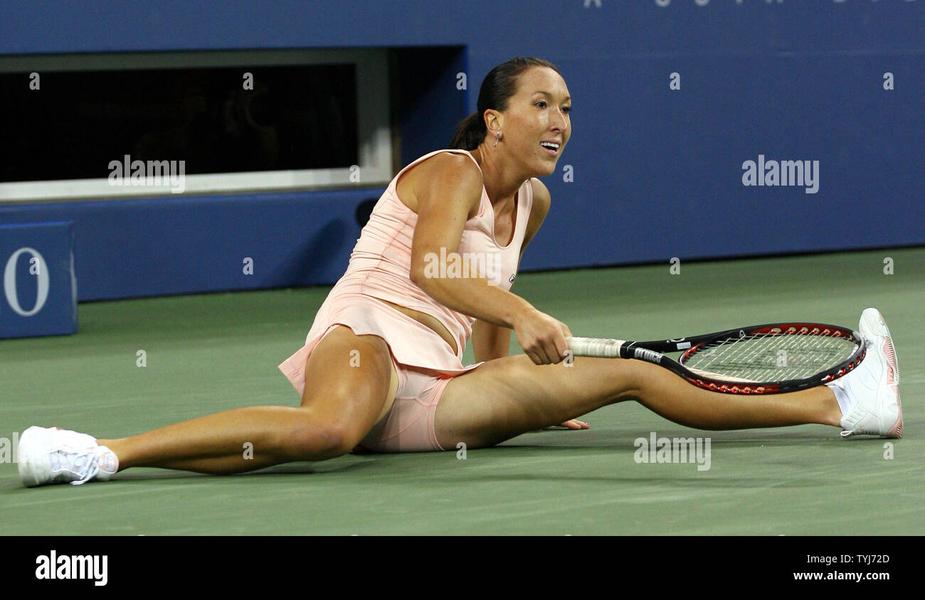 Jelena Jankovic falls to the floor reaching for a ball in the third set of  her quarter finals match against Venus Williams on day10 at the U.S. Open  in New York City