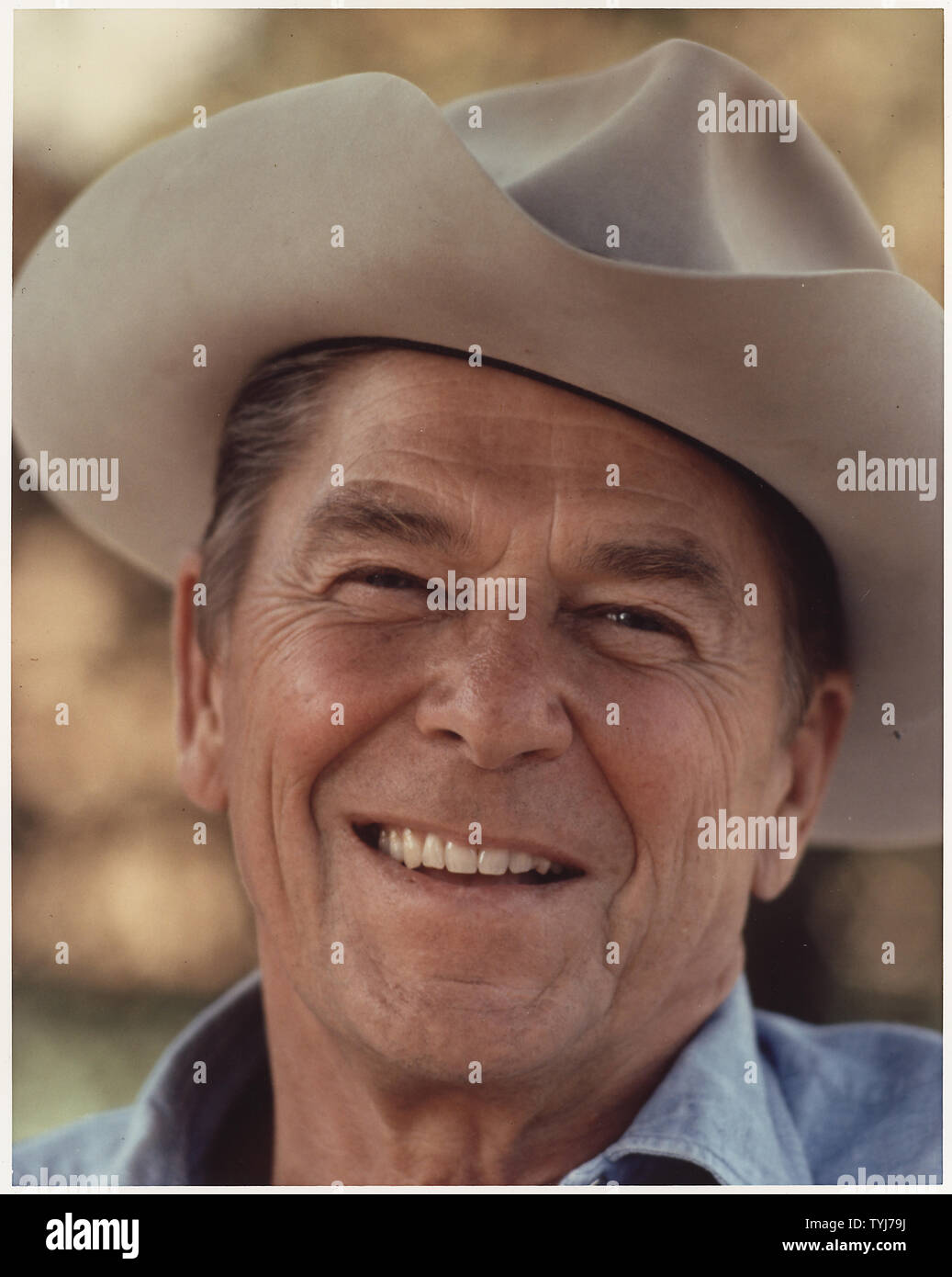 Photograph of Ronald Reagan in a cowboy hat at Rancho Del Cielo; Ronald Reagan wearing cowboy hat at Rancho del Cielo. Stock Photo