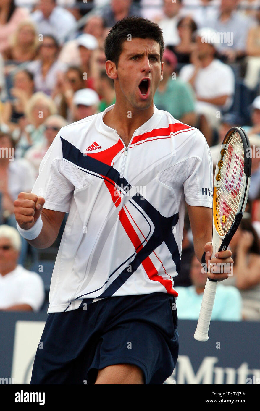 Novak Djokovic pumps his fist after winning a point while playing in the  U.S. Open finals against Roger Federer on day14 at the U.S. Open in New  York City on September 9,