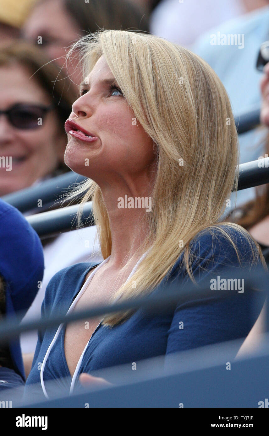 Christie Brinkley makes a funny face when she sees her face on the big  screen while Roger Federer plays Novak Djokovic in the . Open finals  against on day14 at the .