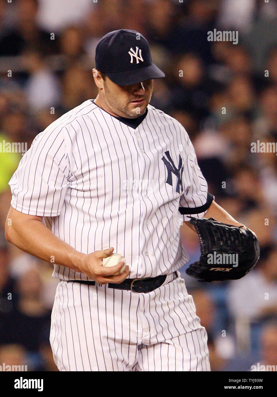 New York Yankees starting pitcher Roger Clemens walks back to the pitchers  mound after giving up a solo homer to Cleveland Indians Trot Nixon in the  second inning during game 3 of
