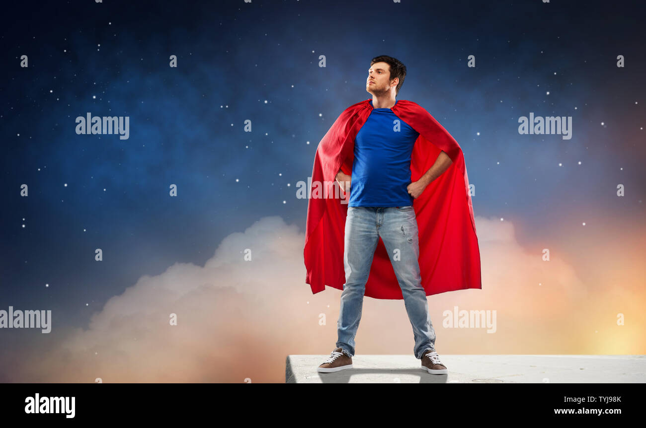 man in red superhero cape over night sky Stock Photo - Alamy