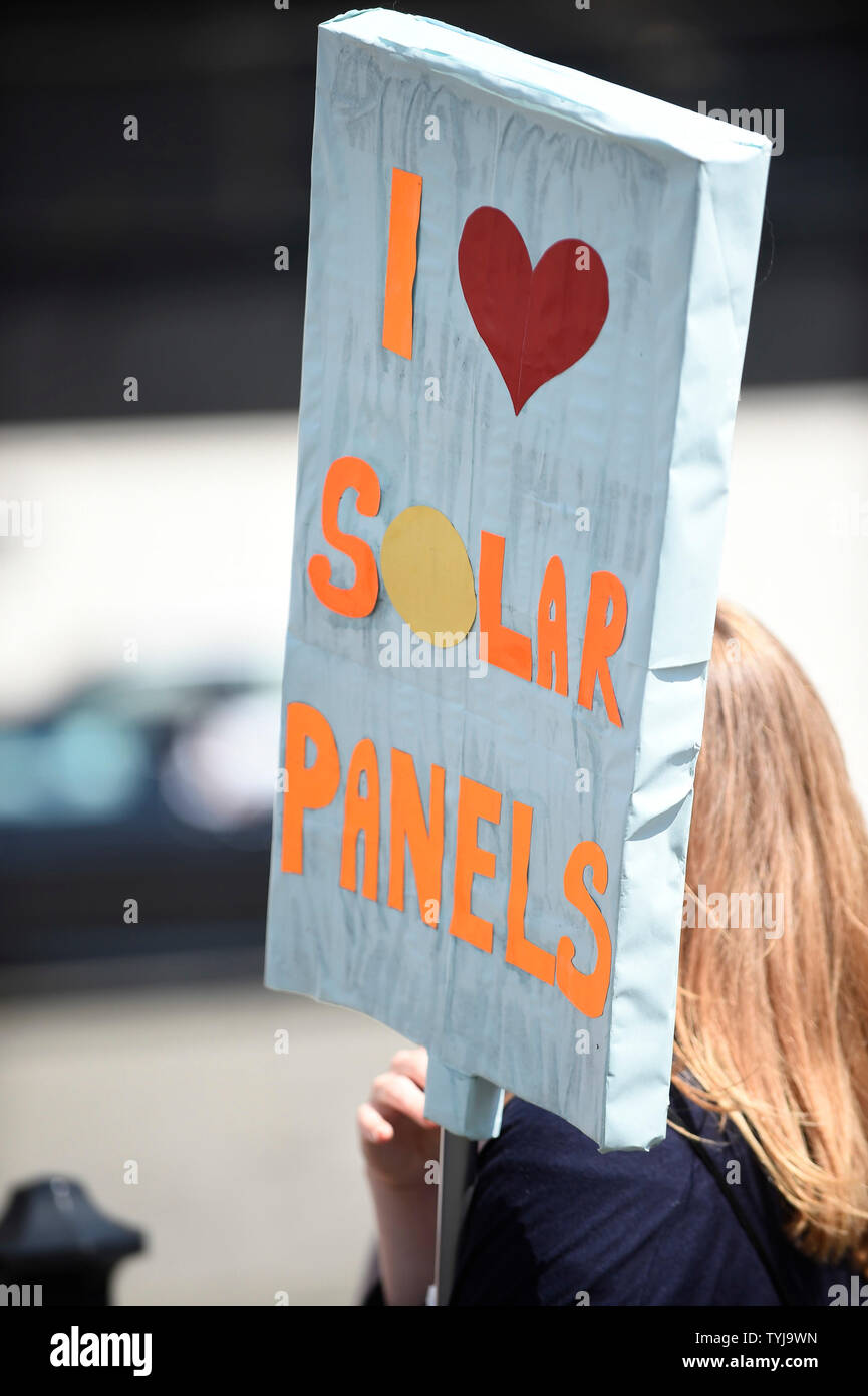 London, UK.  26 June 2019.   A woman with a sign promoting solar panels joins a 'Time Is Now' mass lobby around Parliament.  Activists are attempting to deliver a message to MPs that to tackle the environmental crisis, a strong Environment Bill is passed that can restore nature, cut plastic pollution and improve air quality.  Similar gatherings are taking place across the UK.  Credit: Stephen Chung / Alamy Live News Stock Photo