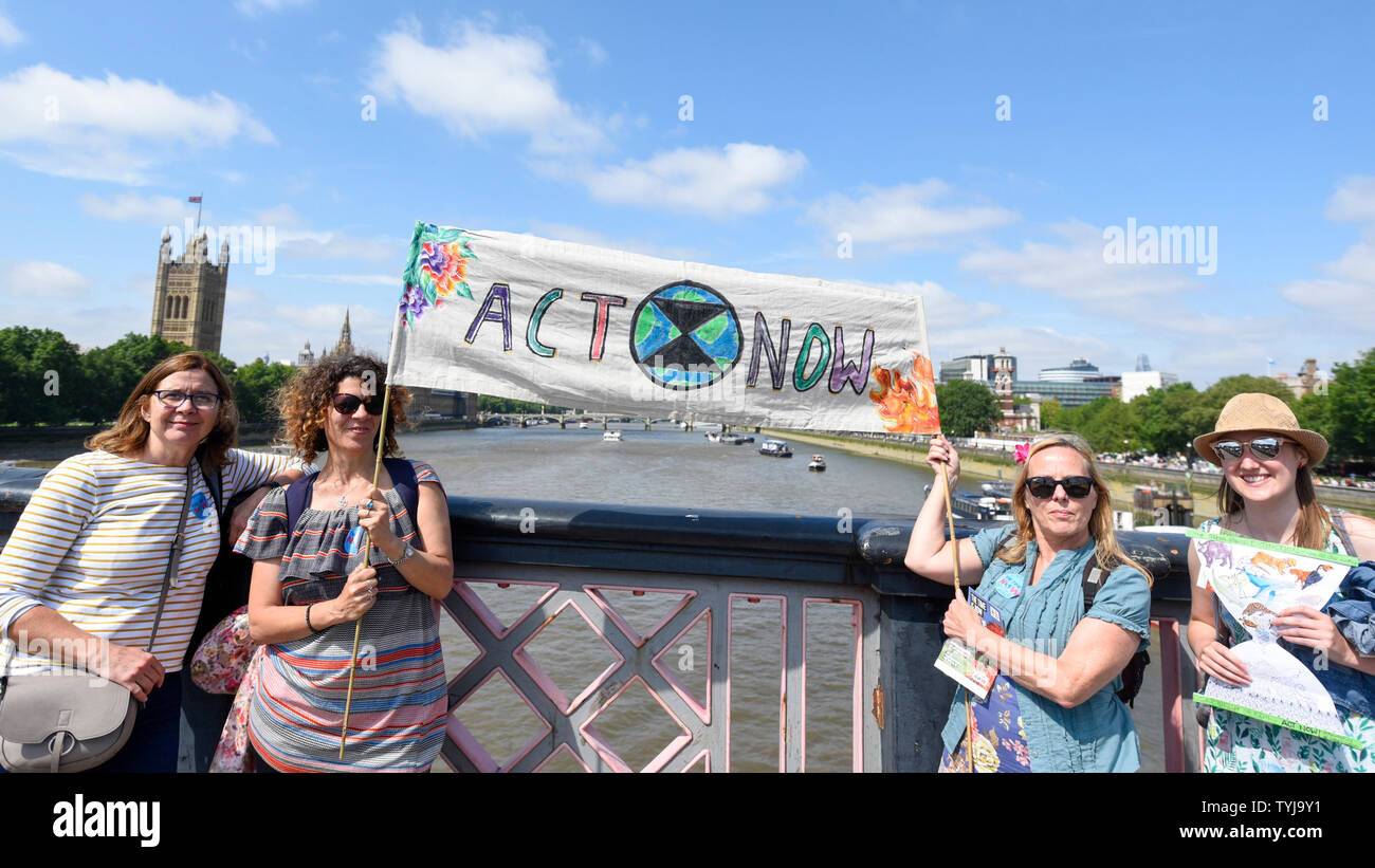 London, UK.  26 June 2019.   Women take part in a 'Time Is Now' mass lobby around Parliament.  Activists are attempting to deliver a message to MPs that to tackle the environmental crisis, a strong Environment Bill is passed that can restore nature, cut plastic pollution and improve air quality.  Similar gatherings are taking place across the UK.  Credit: Stephen Chung / Alamy Live News Stock Photo