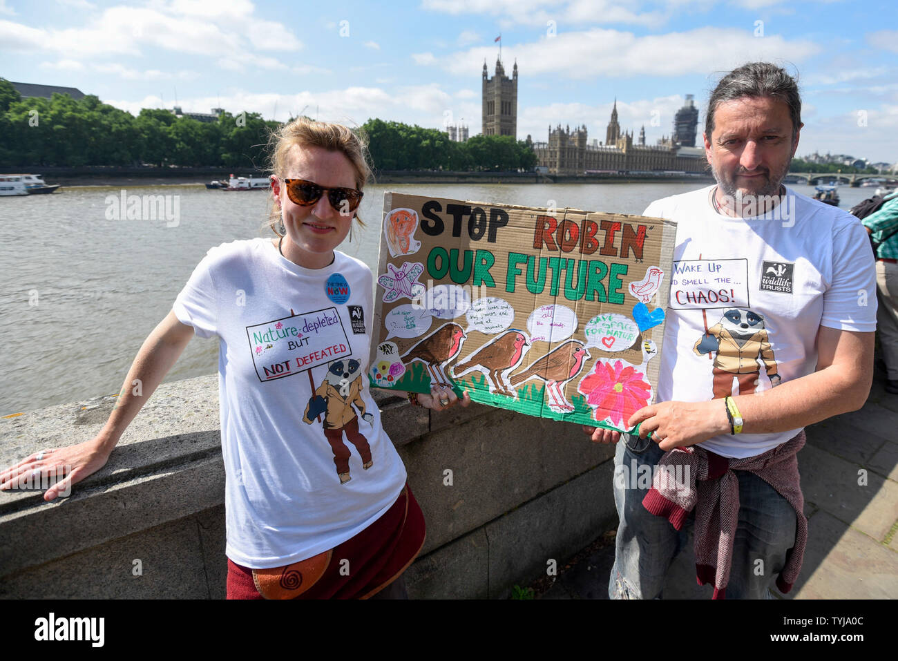 London, UK.  26 June 2019.  Emma and Luke from Worcestershire take part in a 'Time Is Now' mass lobby around Parliament.  Activists are attempting to deliver a message to MPs that to tackle the environmental crisis, a strong Environment Bill is passed that can restore nature, cut plastic pollution and improve air quality.  Similar gatherings are taking place across the UK.  Credit: Stephen Chung / Alamy Live News Stock Photo