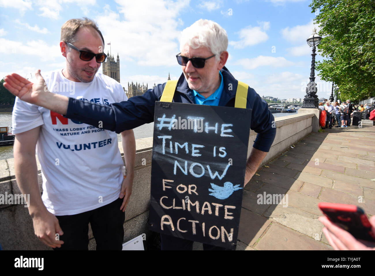 London, UK.  26 June 2019.   A man wears a sandwich board during in a 'Time Is Now' mass lobby around Parliament.  Activists are attempting to deliver a message to MPs that to tackle the environmental crisis, a strong Environment Bill is passed that can restore nature, cut plastic pollution and improve air quality.  Similar gatherings are taking place across the UK.  Credit: Stephen Chung / Alamy Live News Stock Photo